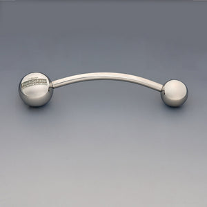 Theros® ProstaSphere: Ergonomic massage device for the prostate and pelvic floor, consisting of a slightly curved shaft with a 45 mm ball as a handle with logo on one side and an interchangeable 36 mm massage sphere on the other side. Front view.