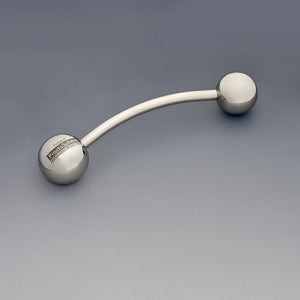 Theros® ProstaSphere: Ergonomic massage device for the prostate and pelvic floor, consisting of a slightly curved shaft with a 45 mm ball as a handle with logo on one side and an interchangeable 40 mm massage sphere on the other side. Left view.